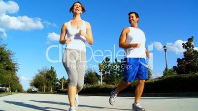 Young Couple Enjoying Jogging Exercise