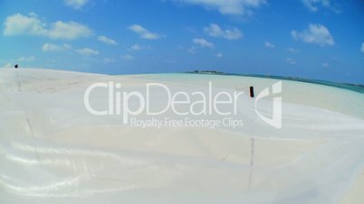 Hammock Swaying Over Tropical Beach in Wide-angle