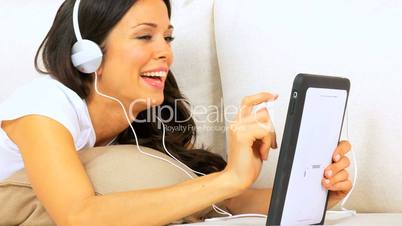 Girl Listening to Music Through Wireless Tablet