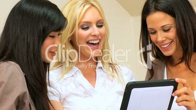 Three Girlfriends Using a Wireless Tablet