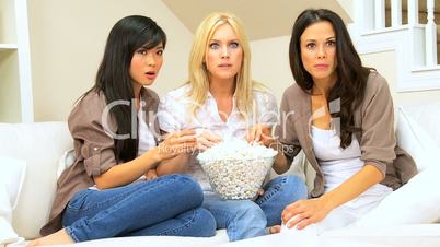 Girlfriends with Popcorn Watching Scary Movie