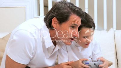 Father & Son Playing on Games Console