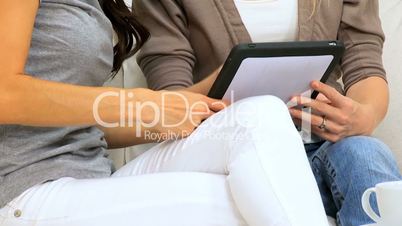 Girlfiends in Close-up with Wireless Tablet