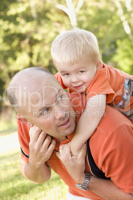 Father and Son Piggyback in the Park