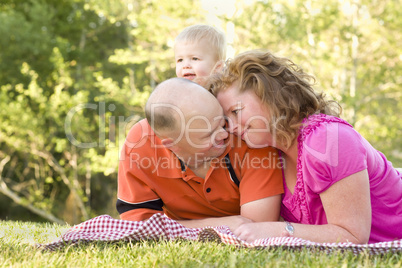 Affectionate Couple with Son in Park