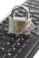 Padlock standing on a keyboard