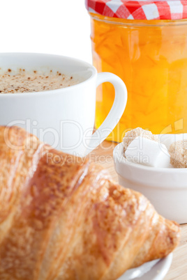 Breakfast with coffee marmalade and croissants