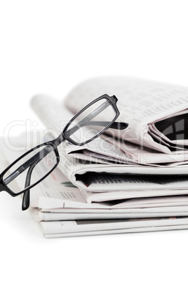 Newspapers and black glasses