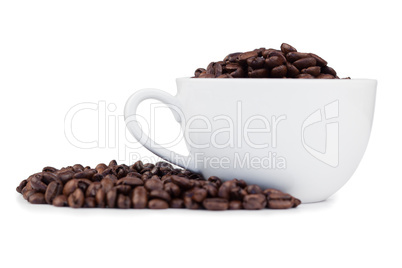 Cup full of coffee beans