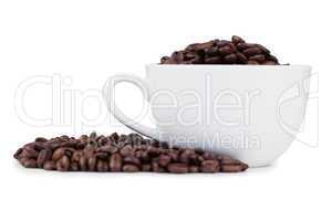 Cup full of coffee beans