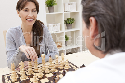 Happy Man & Woman Couple Playing Chess