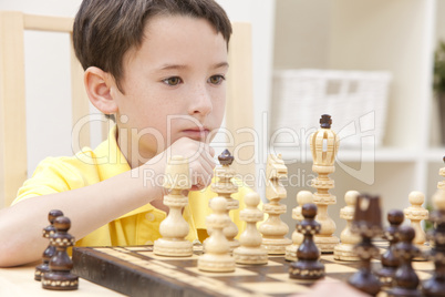 Thoughtful Young Boy Playing Chess