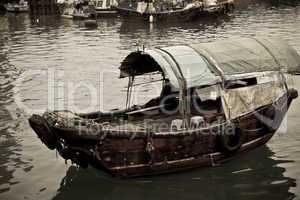 A Sampan boat floating in the sea