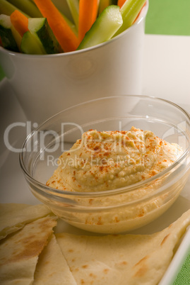 hummus dip with pita bread and vegetable