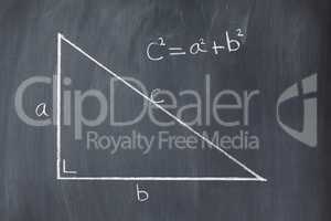 Right triangle with pythagorean formula on a blackboard