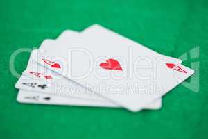 Games card aces on a green playmats