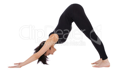 woman stand in yoga pose - Adho Mukha Svanasana