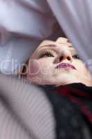 woman close-up face in bedroom scene