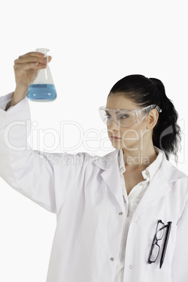 Dark-haired woman conducting an experiment