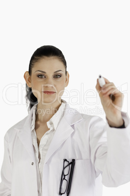 Dark-haired scientist writing on an empty white board