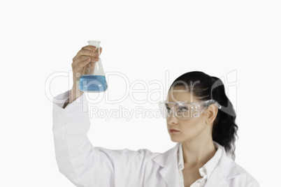 Dark-haired scientist conducting an experiment