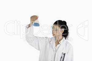 Dark-haired scientist carrying out an experiment