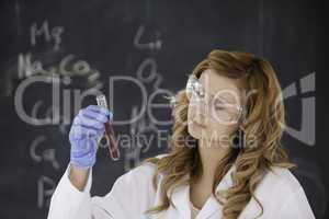 Blond-haired woman conducting an experiment