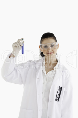 Dark-haired scientist looking at the camera