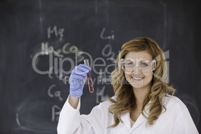 Blond-haired woman carrying out an experiment