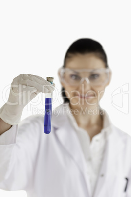 Dark-haired woman conducting an experiment