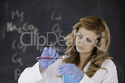 Blond-haired scientist conducting an experiment