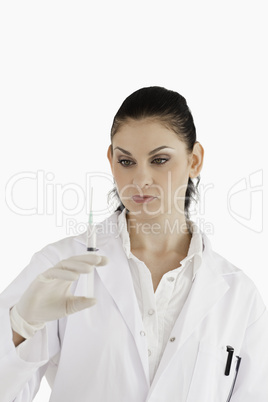 Doctor preparing a syringe