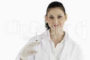 Doctor with syringe looking at the camera