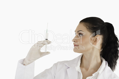 Female doctor preparing a syringe