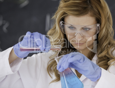 Female scientist conducting an experiment