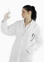 Dark-haired doctor preparing a syringe