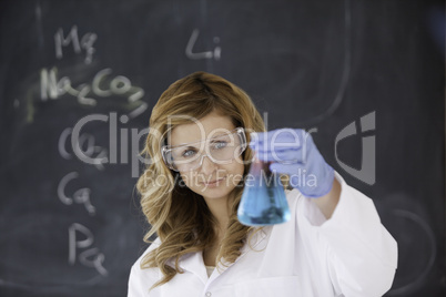 Cute female scientist conducting an experiment