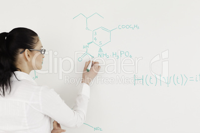 Scientist writing a formula