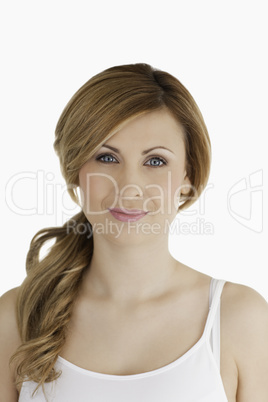 Smiling young woman looking at the camera