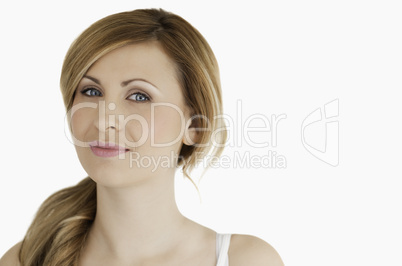 Cute blond-haired woman looking at the camera