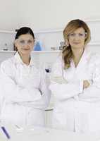 Two female scientists looking at the camera