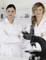 Two female scientists posing
