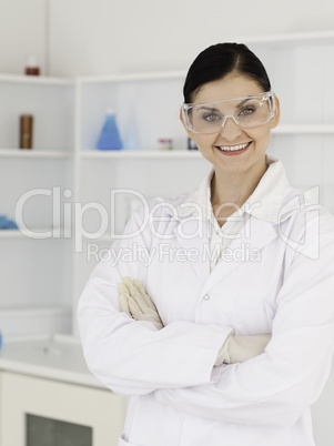 Dark-haired woman with safety glasses