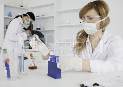 Two women conducting an experiment