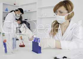 Two women conducting an experiment