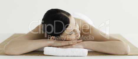 Pretty dark-haired woman getting a spa treatment