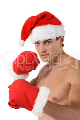 Sexy muscular man boxer wearing a Santa Claus hat