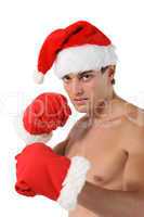 Sexy muscular man boxer wearing a Santa Claus hat