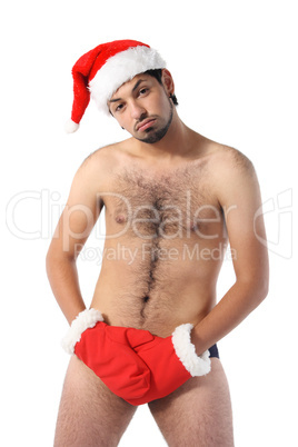 Sexy muscular man wearing a Santa Claus hat isolated on white