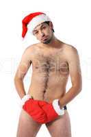 Sexy muscular man wearing a Santa Claus hat isolated on white